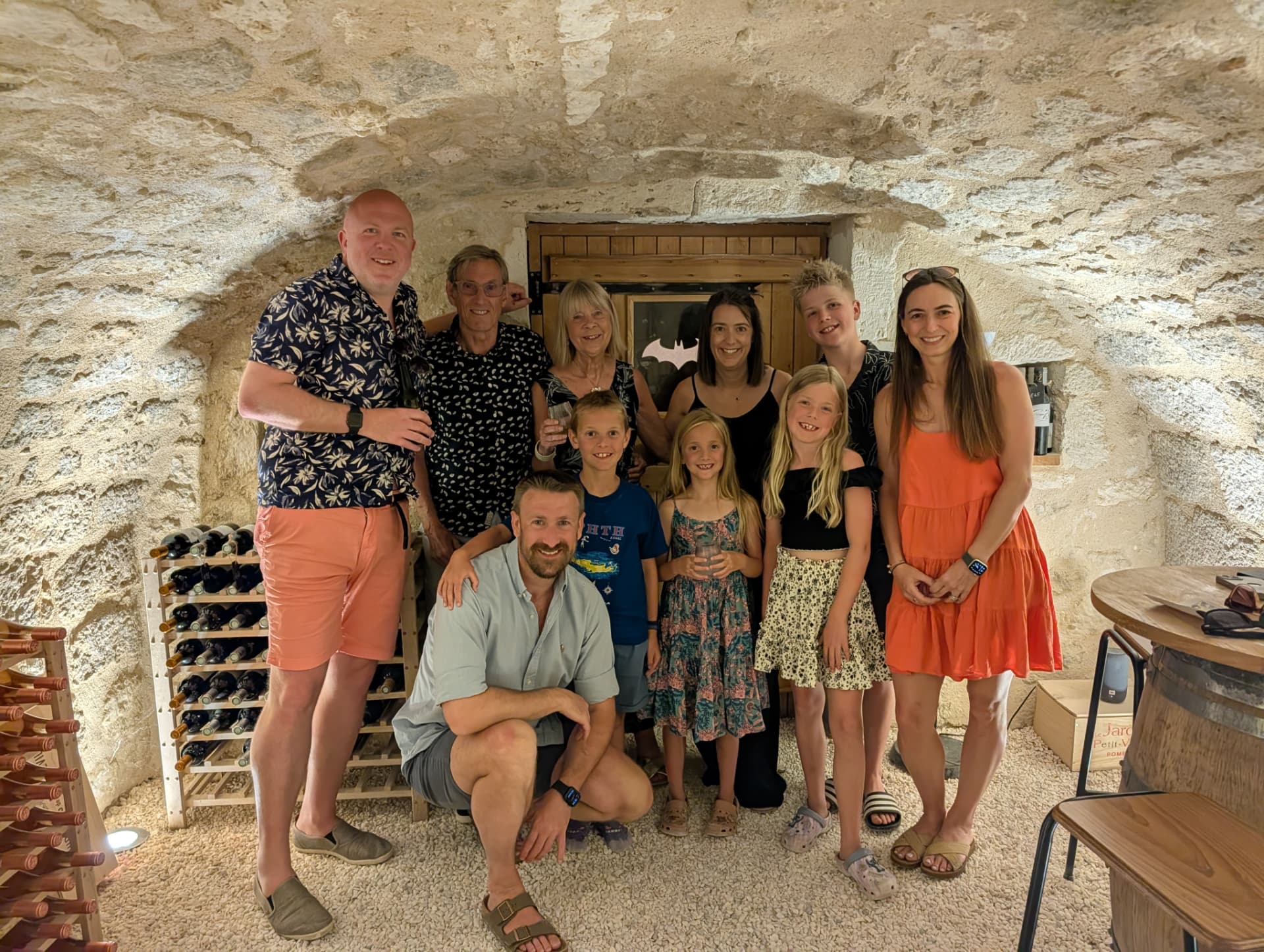 A family group celebrating together in the Bat Cave wine cellar
